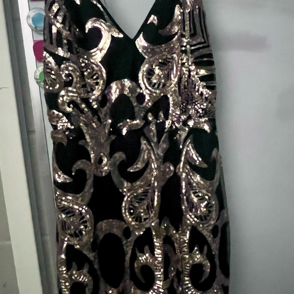 Long, black and gold, formal gown. Classy and Beautiful